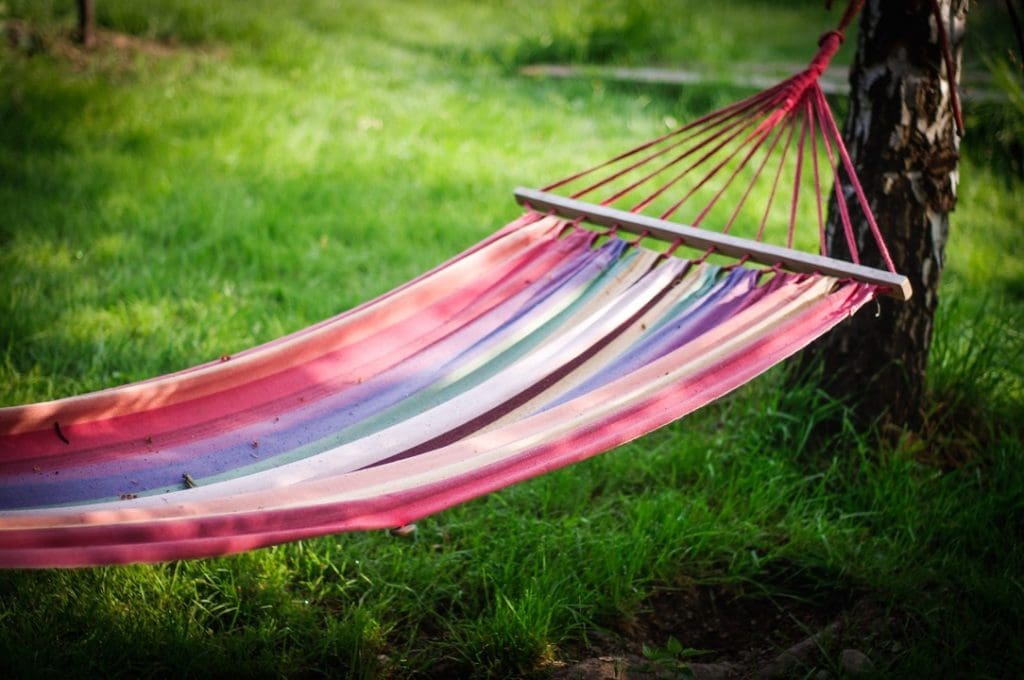 Red hammock tied to a tree